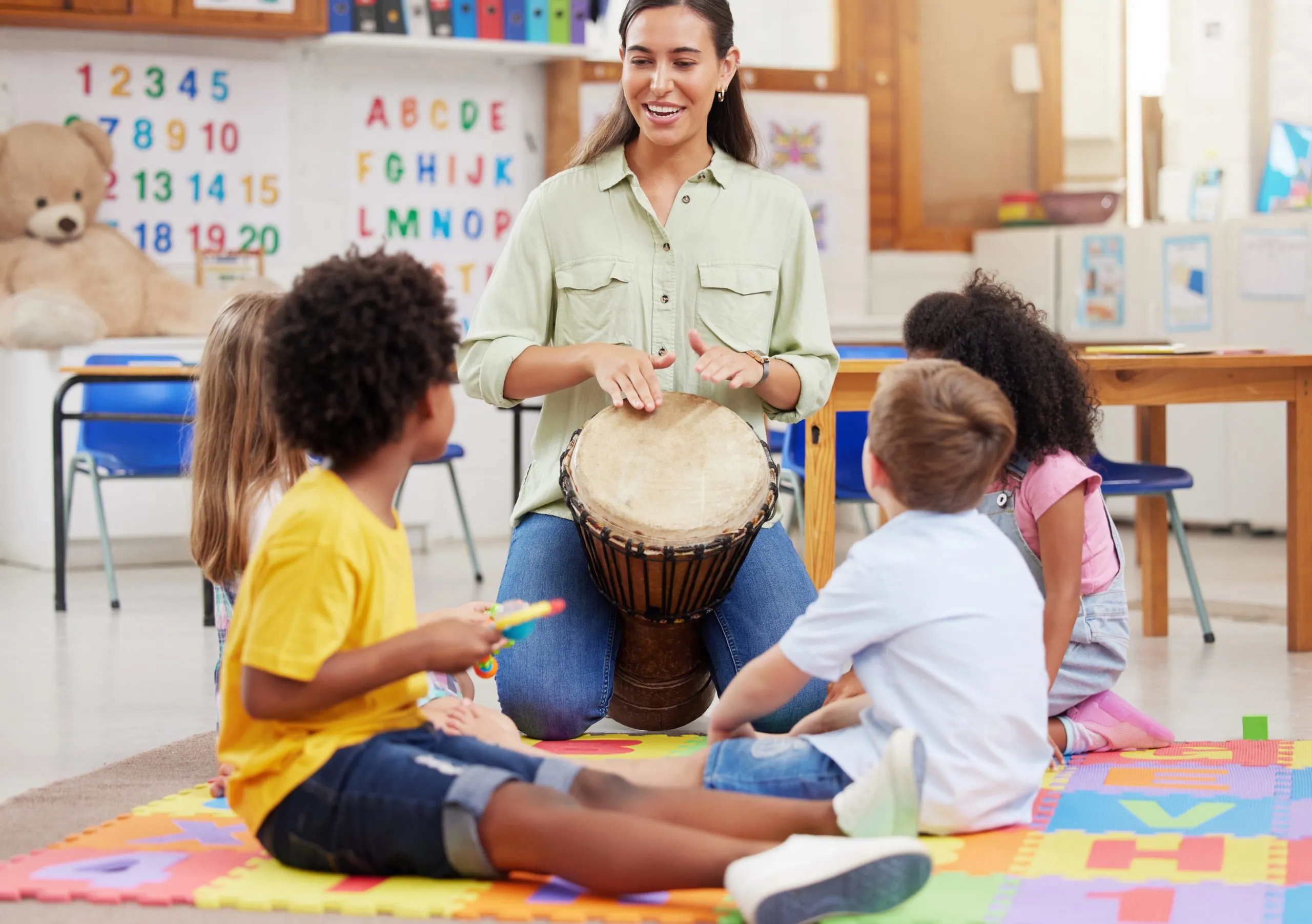 Children playing percussion in a classroom